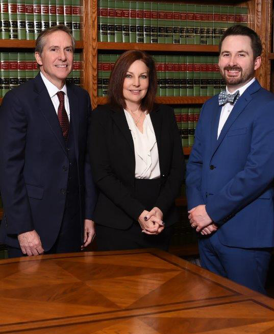 Group Photo of Attorney Andre, Ashley and Patrick